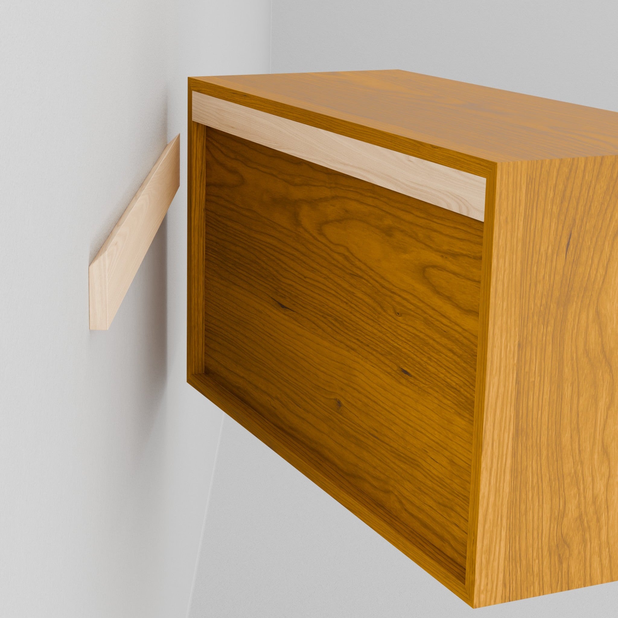 A person holds the Krovel Hardwood Floating Dresser, aligning its recessed back with a wall-mounted bracket to hang it securely using the included French cleat system.