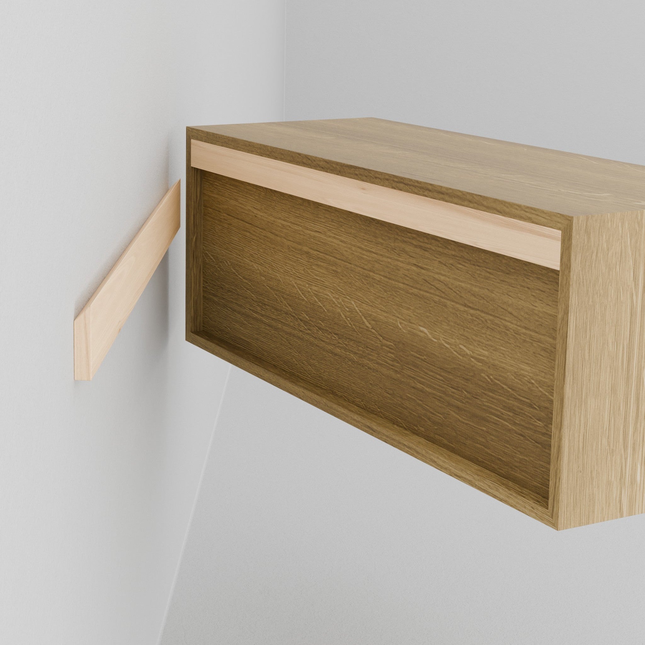 The Krovel Hardwood Double Floating Nightstand, handmade from solid wood with an open drawer, is mounted on a white wall beside a bed with white bedding and a striped rug visible on the floor.