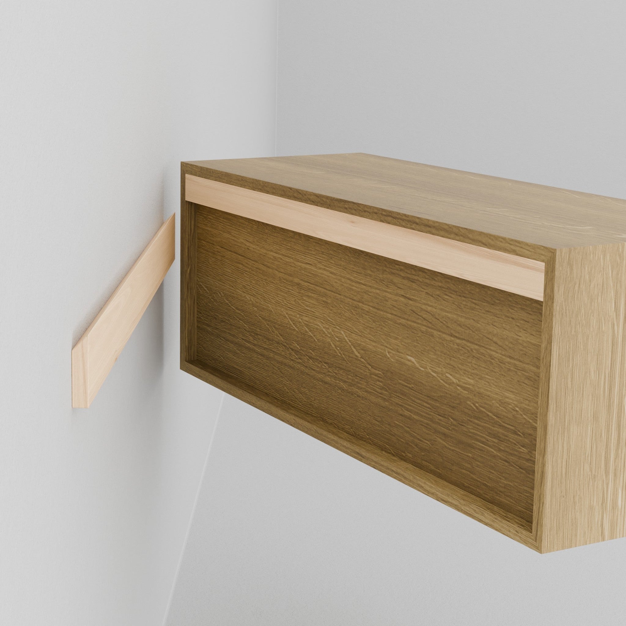 A person holds the Krovel Hardwood Floating Display Case, aligning its rear groove with a wooden mounting bracket on a white wall—designed for secure, floating shelves-style installation.