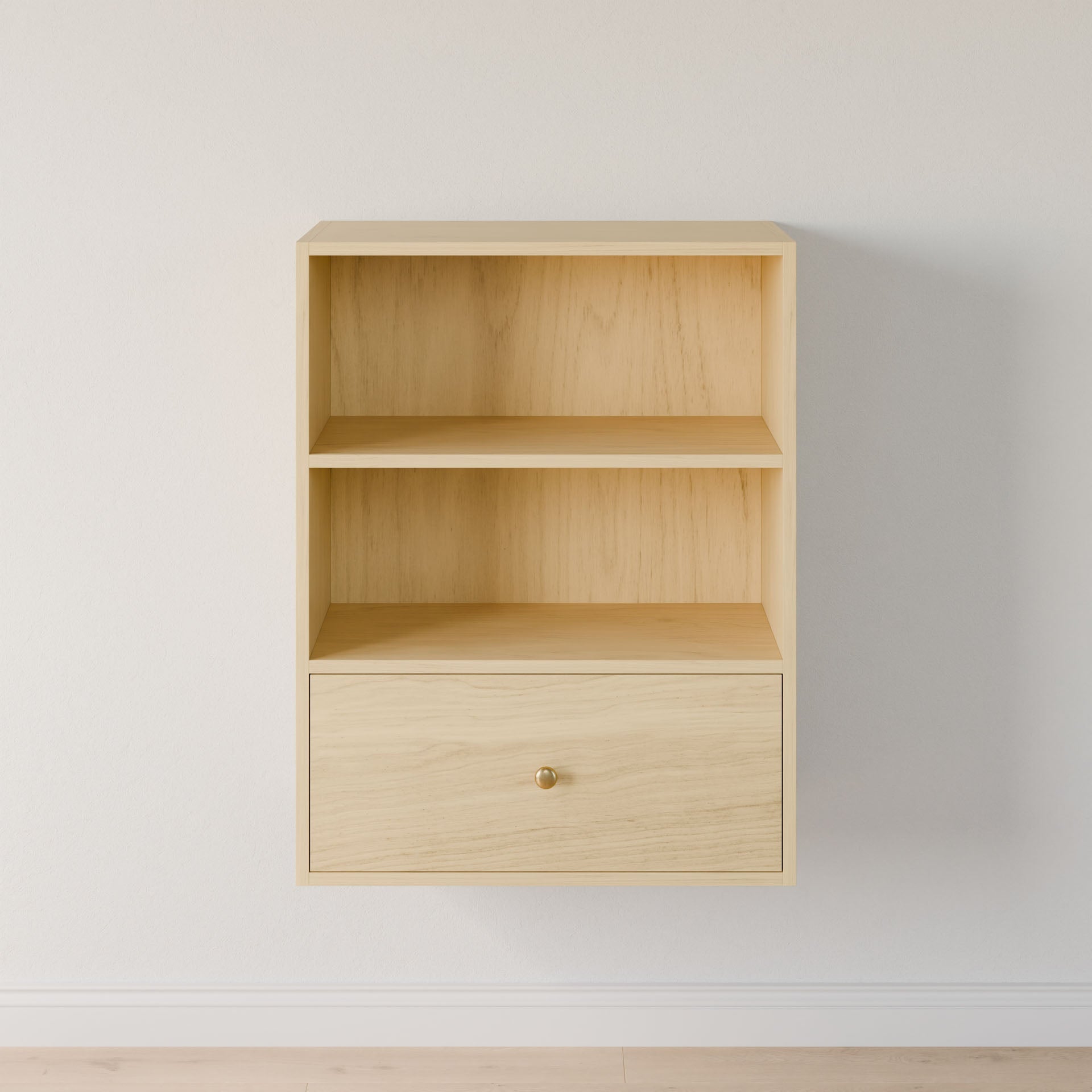 The Maine Made Closet Drawers by Krovel Furniture Co. is a light wood, wall-mounted shelf with two open compartments and a single drawer featuring a round brass knob—perfect for elegant closet organization against white walls.