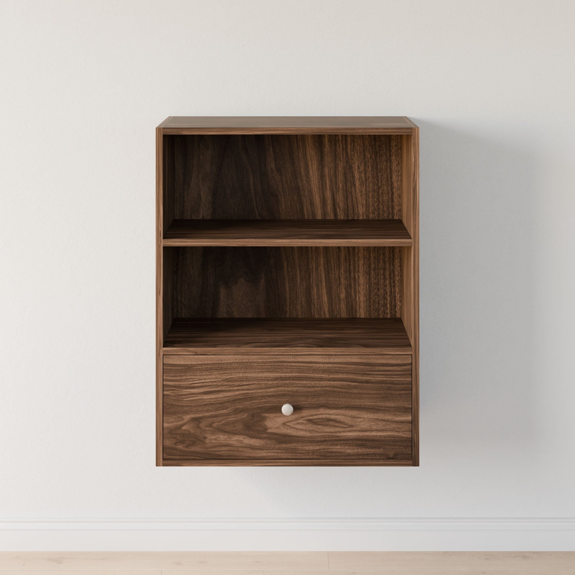 The Maine Made Closet Drawers by Krovel Furniture Co. is a wall-mounted cabinet crafted from premium plywood, featuring an open top shelf and a drawer with a round knob—ideal for organizing closets against a white wall.