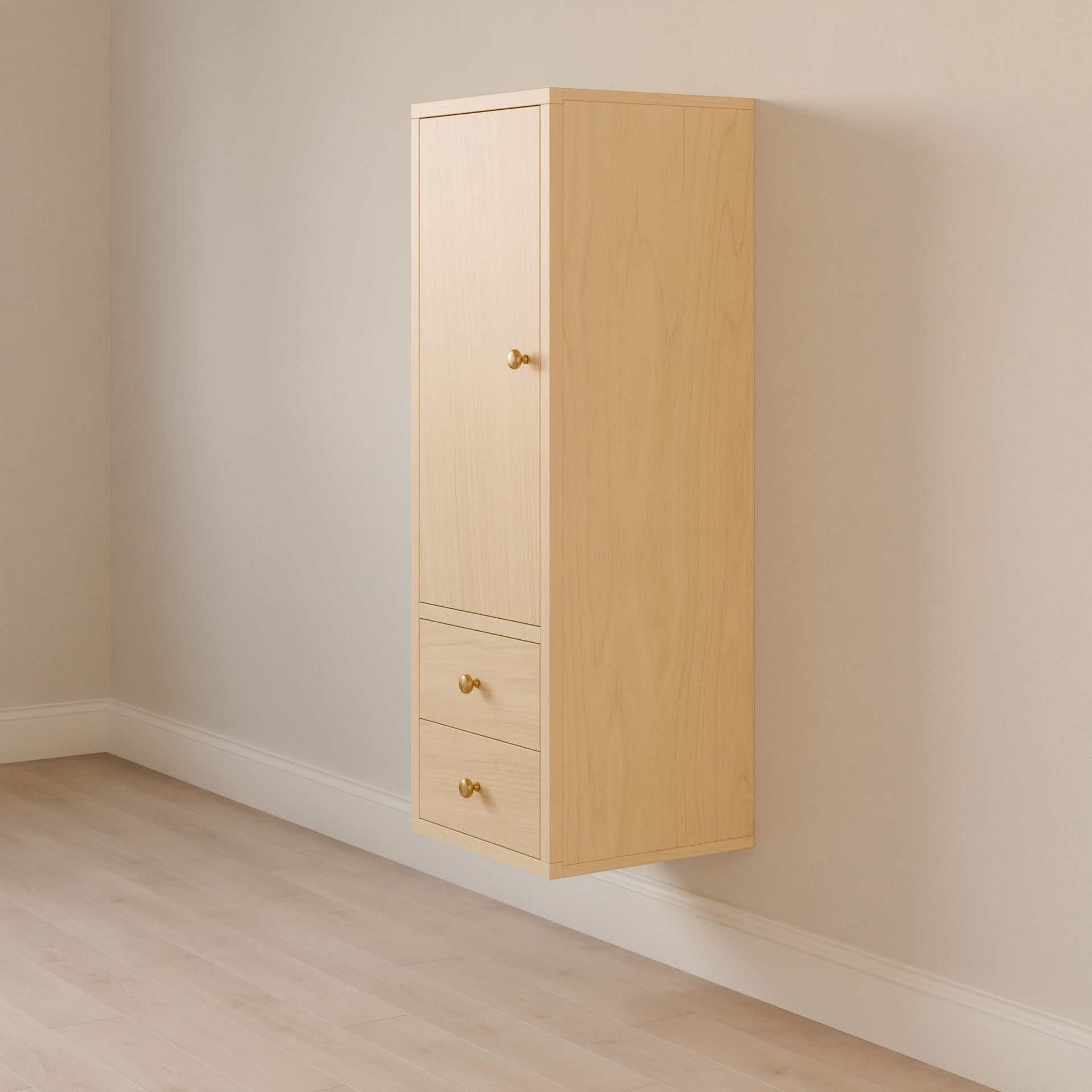 The Maine Made Double Drawer Linen Cabinet by Krovel Furniture Co. features solid hardwood in light wood, a wall-mounted design with a top door and two drawers below, each with small round knobs, shown against a light wall and floor.