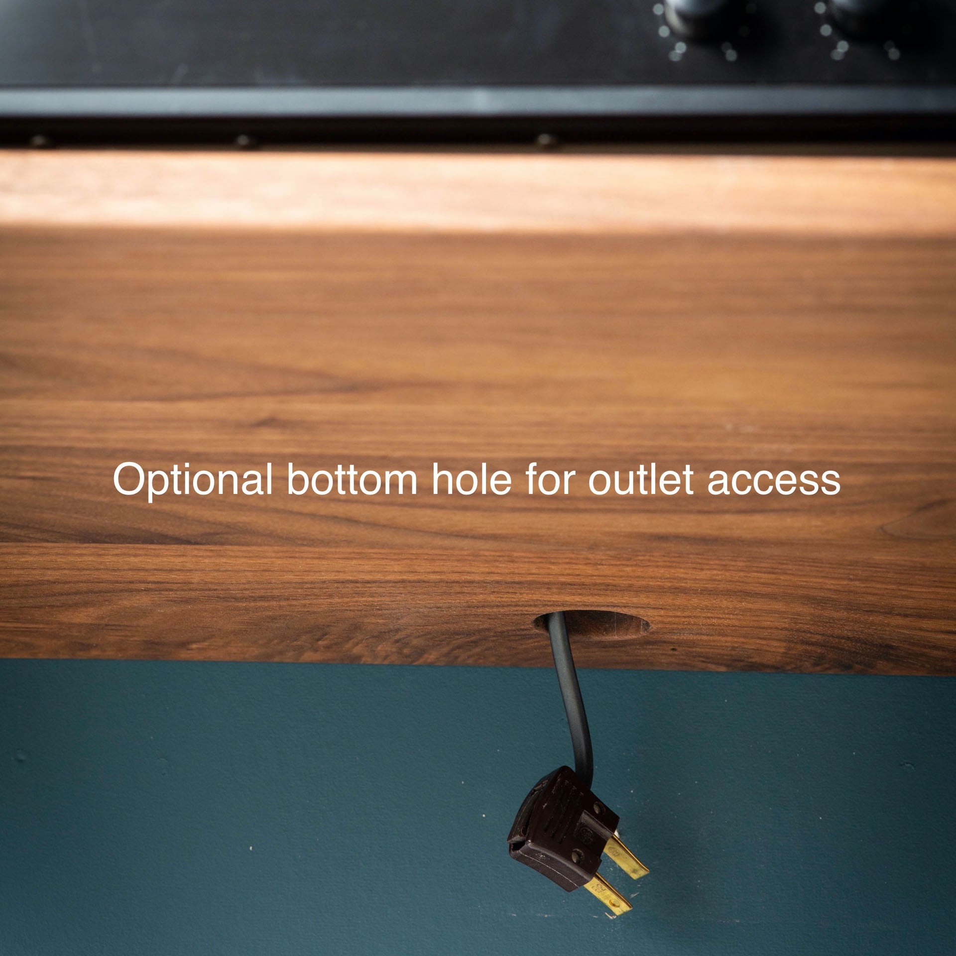 The Krovel Hardwood Oversized Media Console includes a solid hardwood TV stand design with an optional small round hole near the bottom edge for easy outlet access. Text on the image: Optional bottom hole for outlet access.