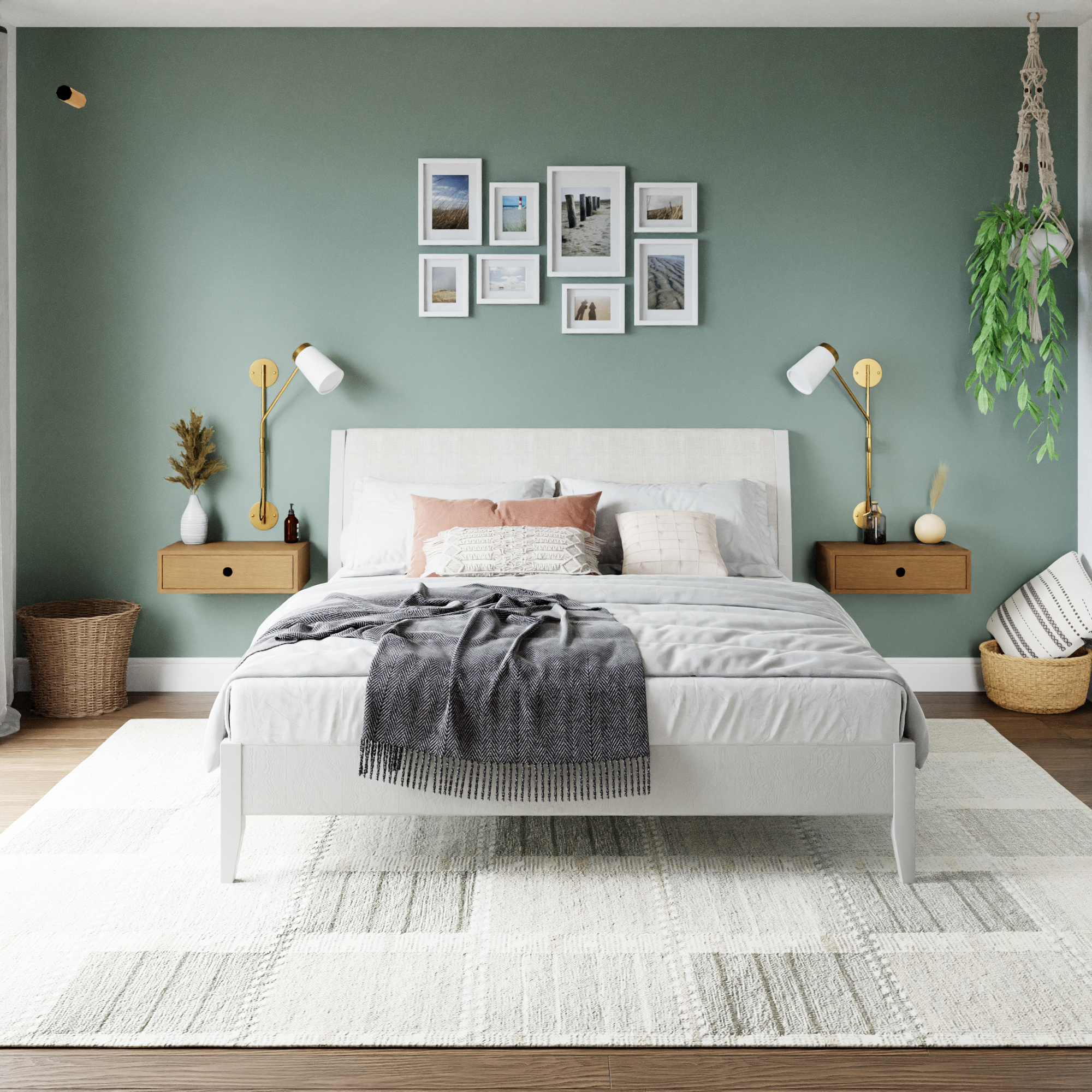 A modern bedroom with a white bed, gray bedding, green accent wall, two floating nightstands, wall lamps, framed photos above the bed, and a hanging plant in the corner.