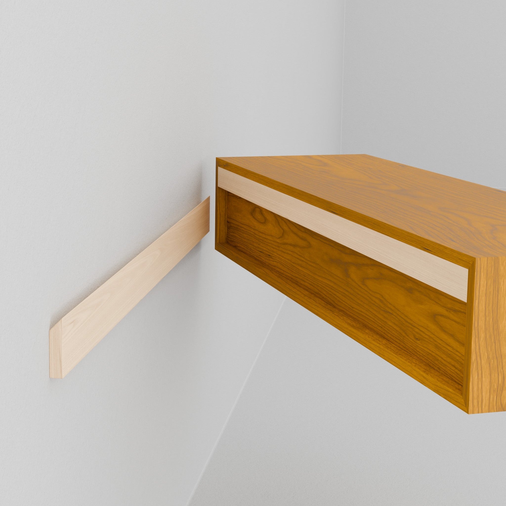 A person holds the Krovel Hardwood Floating Desk, featuring a mounting groove on the back, and aligns it with a matching wooden bracket mounted on the wall for installation.
