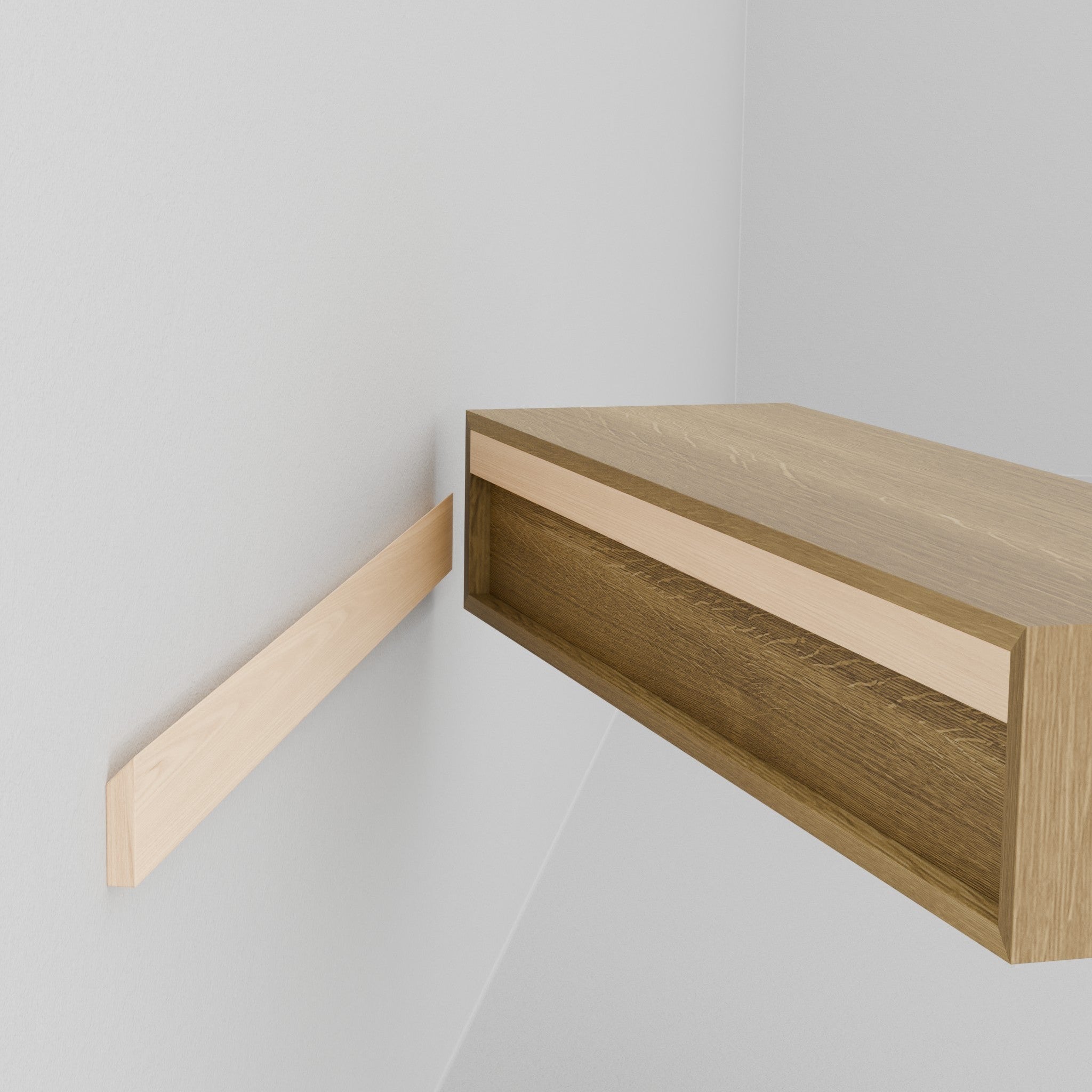 A person is installing the Krovel Hardwood Floating Desk onto a white wall, holding the desk with both hands as it’s about to be placed onto its hidden wall-mounted support bracket.