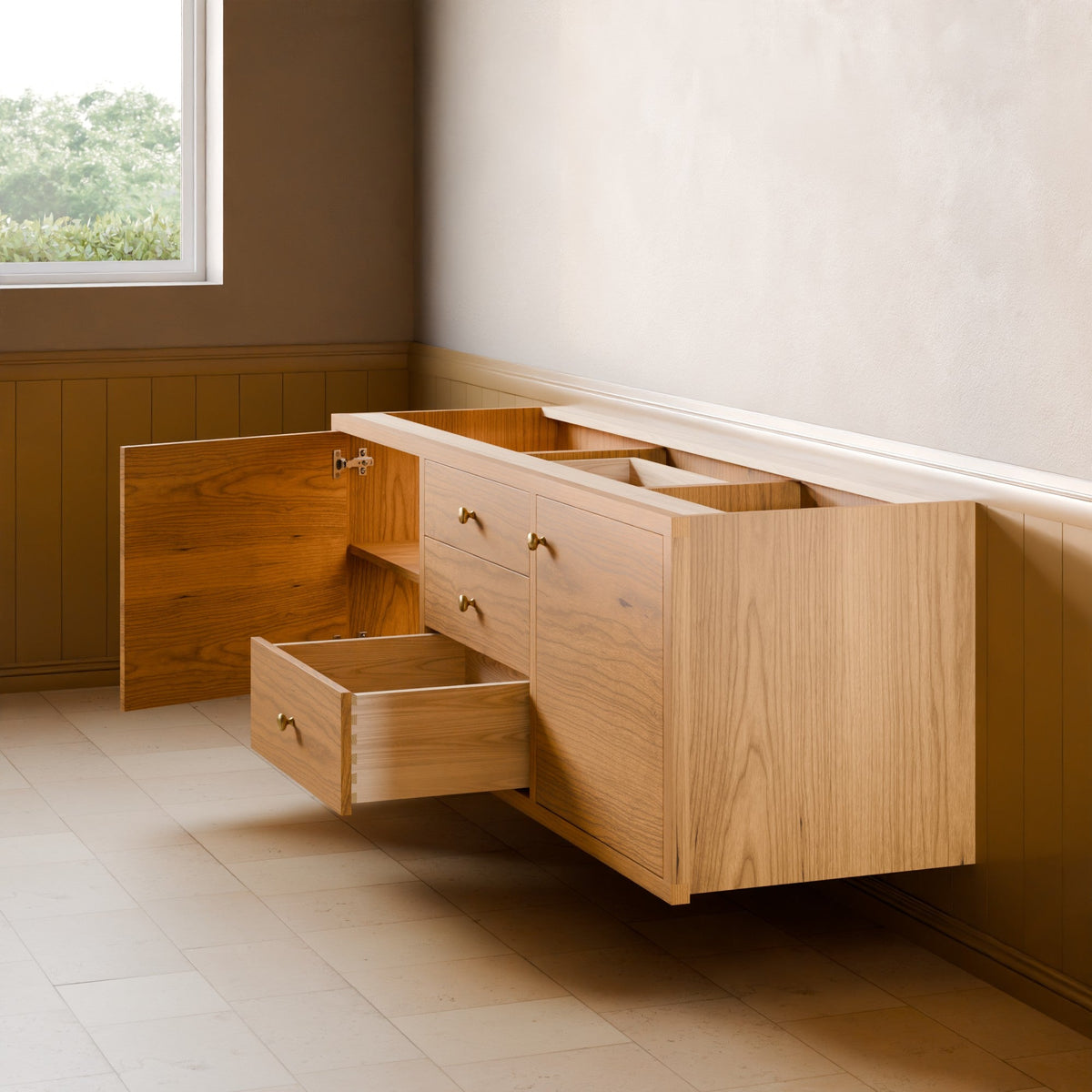 A light oak wood wall-mounted storage cabinet with multiple drawers and open shelving, shown in a real room with a window, paneled wall, and tiled floor.