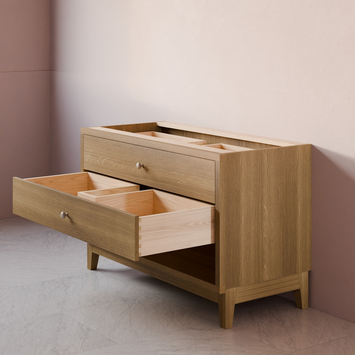 A light oak wood storage cabinet with two open drawers, shown in a minimalist room corner with a beige wall and gray floor.