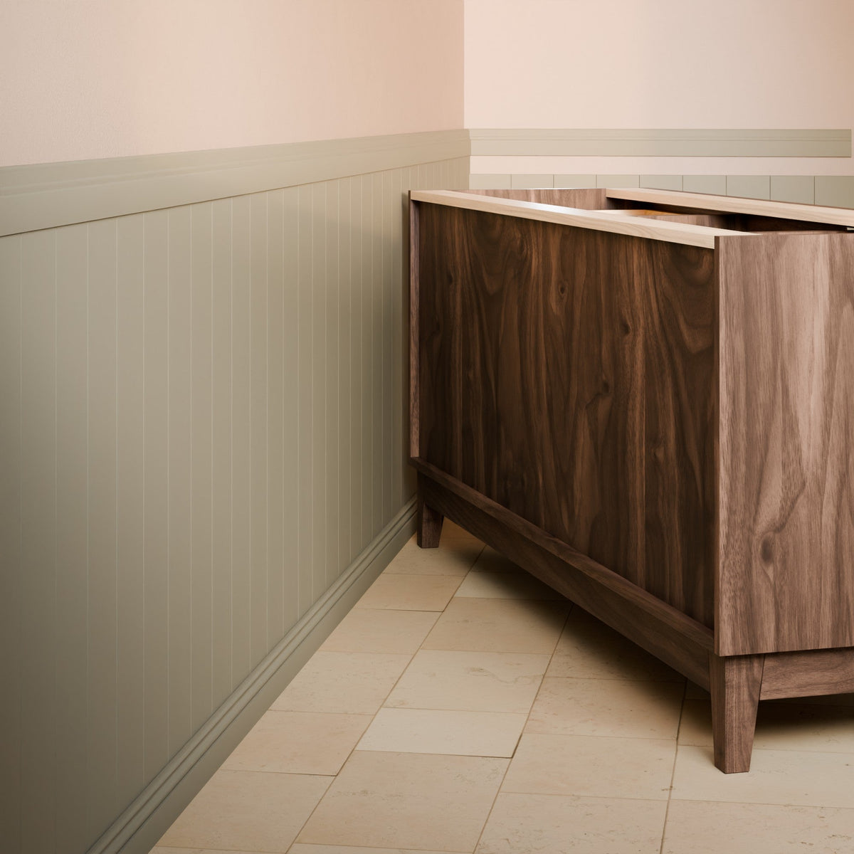 A dark brown wooden vanity cabinet with a light wood top, shown in a bathroom corner with beige tile flooring and paneled walls.