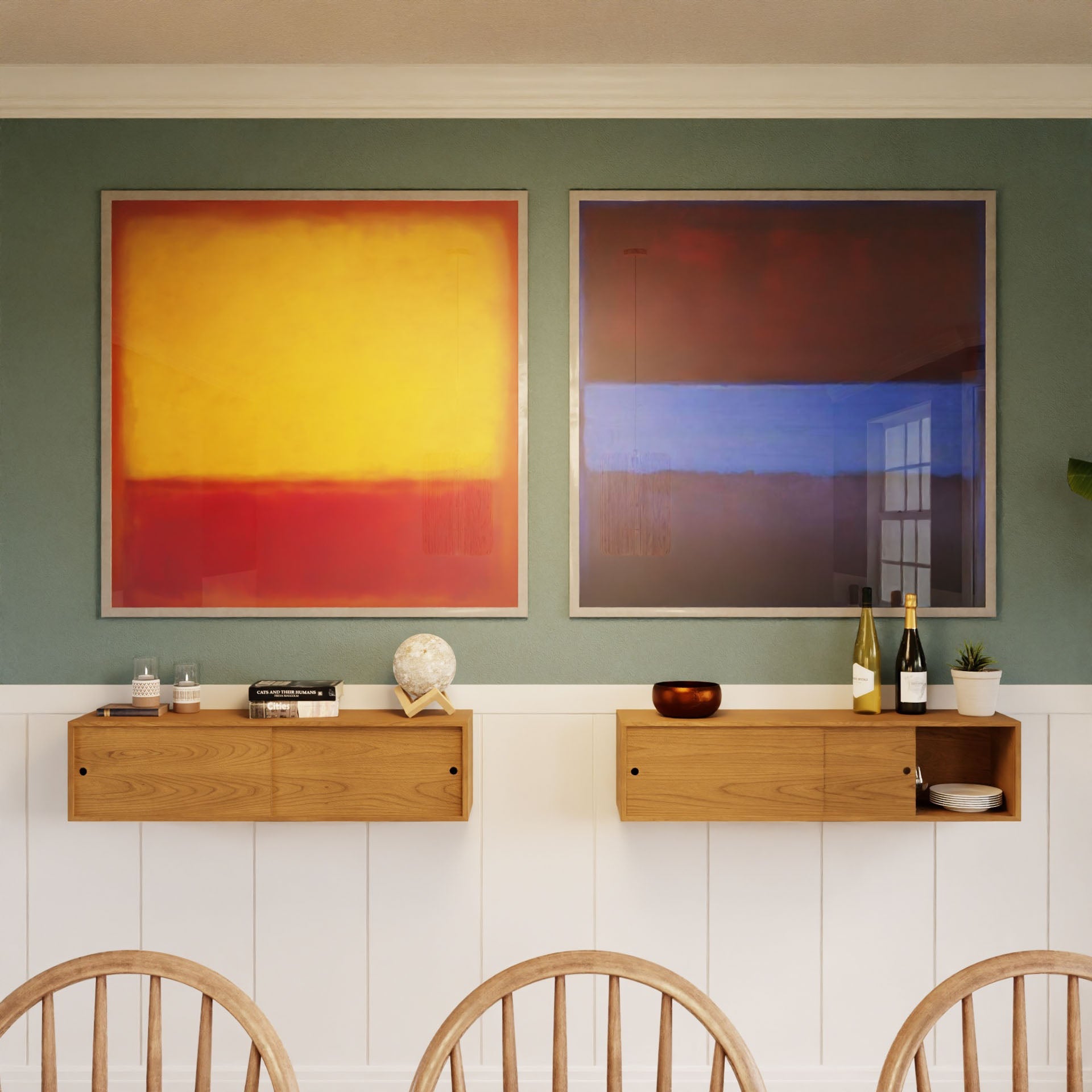 Two abstract paintings hang above the Krovel Floating Storage Cabinet in Cherry, which displays decor, books, wine, and glasses. The left painting is yellow and red; the right features blue and brown. Light wooden chairs sit in front.
