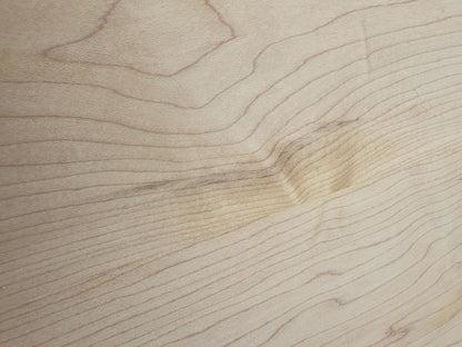 Close-up of the Maple Console Table - UNFINISHED by Krovel Furniture Co., showcasing its light-colored solid maple surface with visible grain patterns and a subtle indentation in the center.