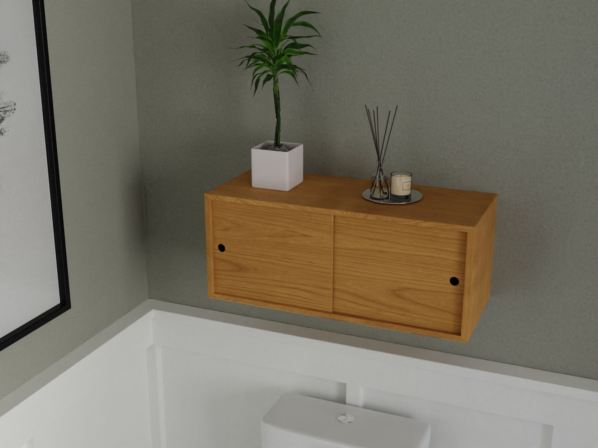 The Krovel Floating Storage Cabinet in Cherry with two doors is mounted above a white toilet in a modern bathroom, decorated with a potted plant, candles, and reed diffusers.