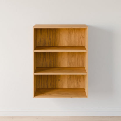 The Maine Made Closet Shelves by Krovel Furniture Co. are simple, empty wooden shelves with three tiers, crafted from premium-grade cabinet plywood and mounted on a plain white wall above a light-colored floor.