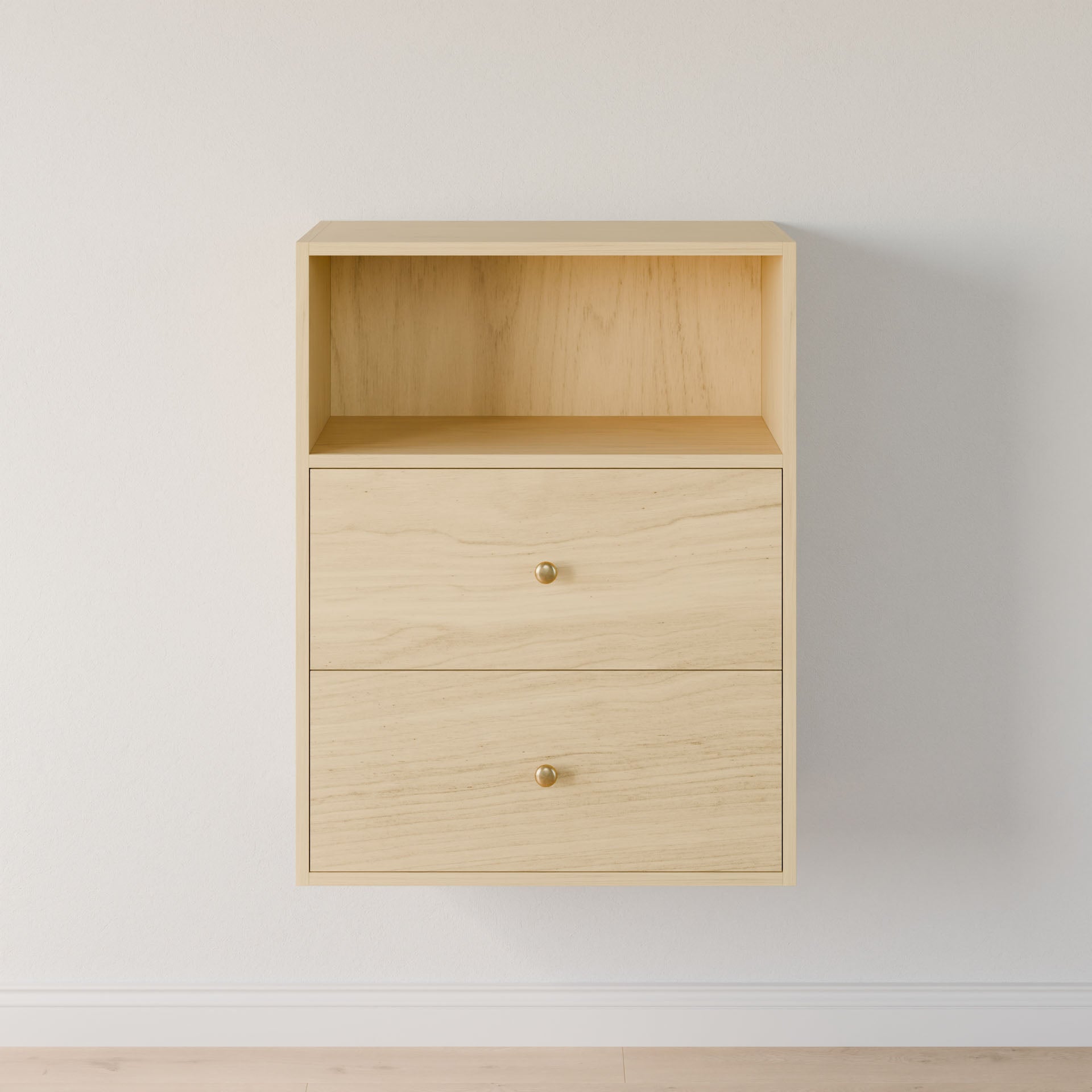 The Maine Made Closet Drawers by Krovel Furniture Co. is a light wood, wall-mounted cabinet with premium plywood, two drawers with gold knobs, and an open shelf on top, shown against a white wall and light wood floor.