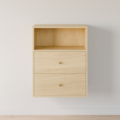 The Maine Made Closet Drawers by Krovel Furniture Co. is a light wood, wall-mounted cabinet with premium plywood, two drawers with gold knobs, and an open shelf on top, shown against a white wall and light wood floor.