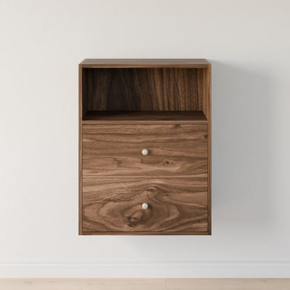 The Maine Made Closet Drawers by Krovel Furniture Co. is a floating wooden wall cabinet with premium cabinet plywood, an open top shelf, two drawers with silver knobs, and a natural wood grain finish—perfect for organizing your closet above light flooring.