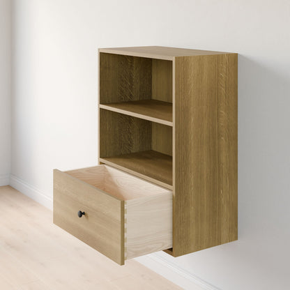 The Krovel Furniture Co. Maine Made Closet Drawers is a wooden, wall-mounted cabinet with two open shelves and a partly open bottom drawer with a black round knob—perfect for closet organization against a white wall and light wood floor.