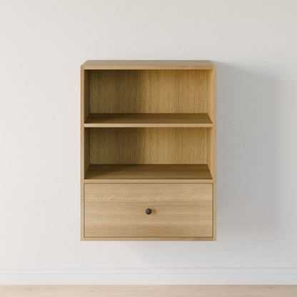 The Maine Made Closet Drawers by Krovel Furniture Co. is a light wood wall-mounted shelf with two open compartments and a single drawer, crafted from premium cabinet plywood for durability—ideal for closet organization against white walls.