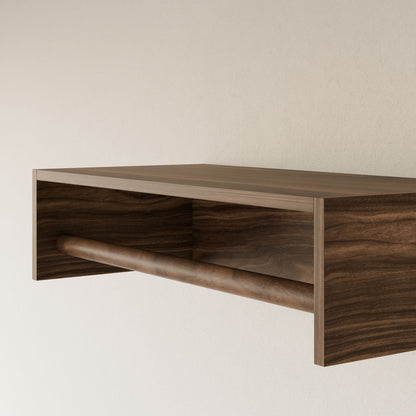 The Maine Made Closet Hanger by Krovel Furniture Co. is a minimalist plywood wall shelf with an open compartment and a horizontal rod—handmade in Portland, Maine—ideal as a modular closet hanger for light-colored walls.