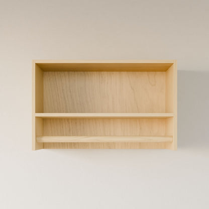 The Maine Made Closet Hanger with Shelf by Krovel Furniture Co. is a handmade, two-tier wall shelf with a horizontal rod, crafted in Portland, Maine from premium cabinet plywood. Shown empty and mounted on a light-colored wall.