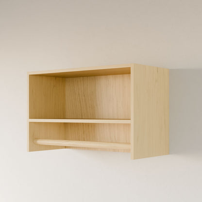 The Maine Made Closet Hanger with Shelf by Krovel Furniture Co. is a handmade wooden wall shelf from Portland, Maine, featuring two open compartments and a horizontal bar below, shown against a plain light wall.
