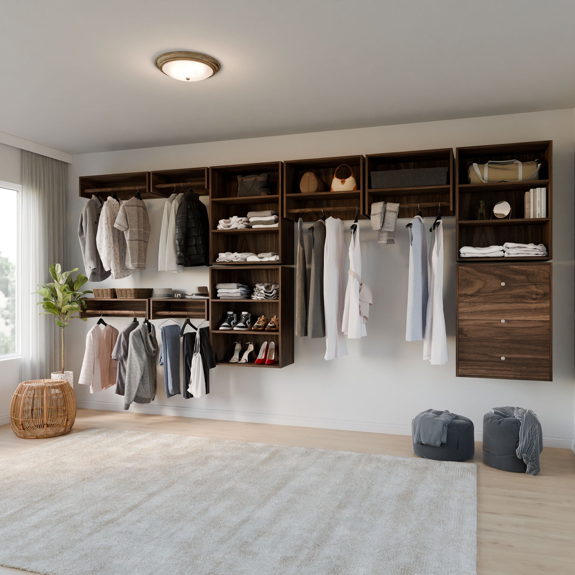 The Maine Made Closet Hanger with Shelf by Krovel Furniture Co. offers modern, organized storage for clothes, shoes, bags, and accessories in a dark wood finish. A large window brings in natural light and two laundry baskets rest on a soft beige rug.