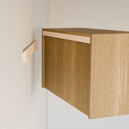 The Maine Made Closet Hanger with Shelf by Krovel Furniture Co., crafted with premium cabinet plywood and a minimalistic natural wood finish, is partially installed on a white wall beside a modular closet bracket.