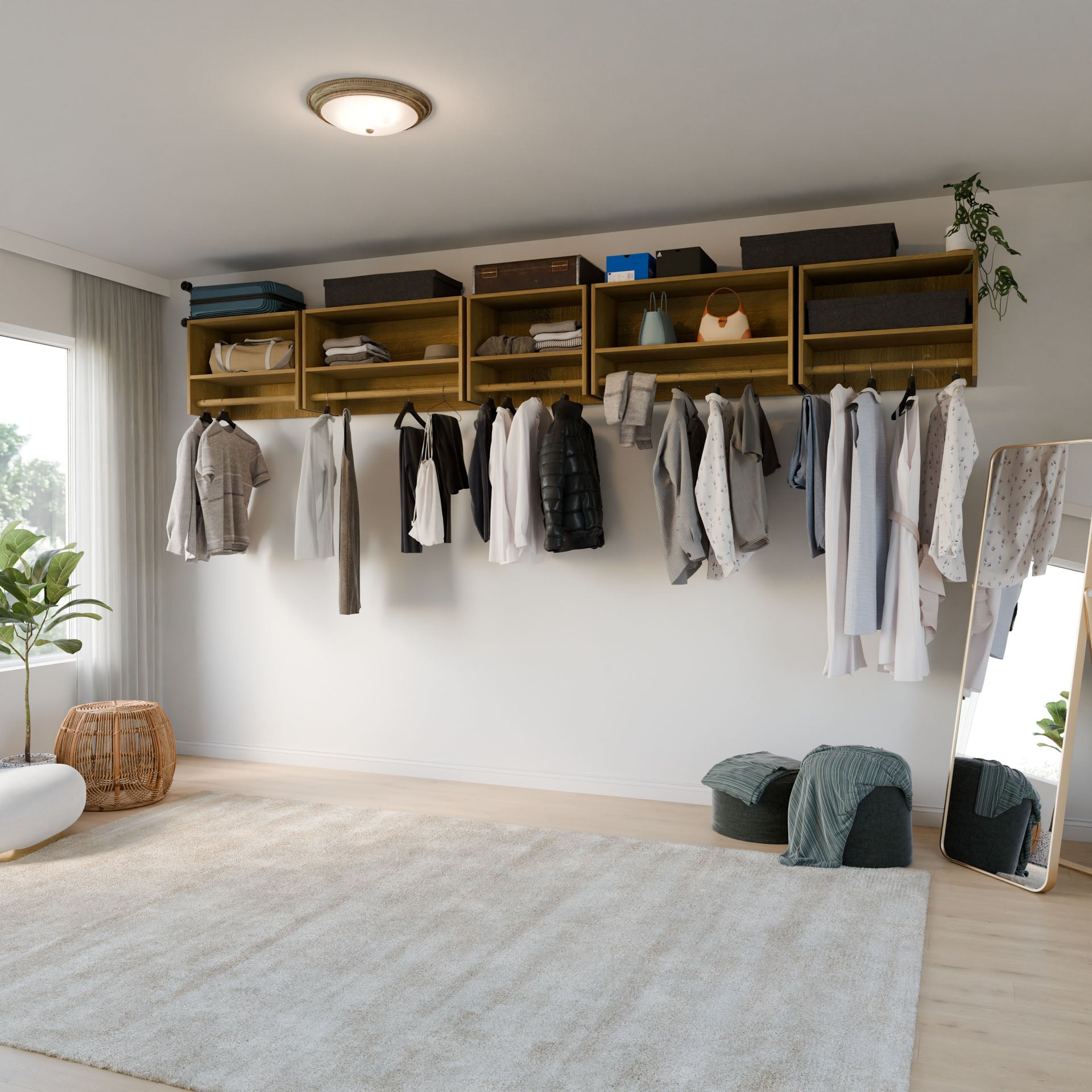 A modern closet features the Krovel Furniture Co. Maine Made Closet Hanger with Shelf above neatly hung clothes, open shelves with storage boxes, plus a full-length mirror, pouf, plants, and a beige rug on wooden floors in a bright room.