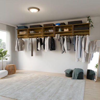 A modern closet features the Krovel Furniture Co. Maine Made Closet Hanger with Shelf above neatly hung clothes, open shelves with storage boxes, plus a full-length mirror, pouf, plants, and a beige rug on wooden floors in a bright room.
