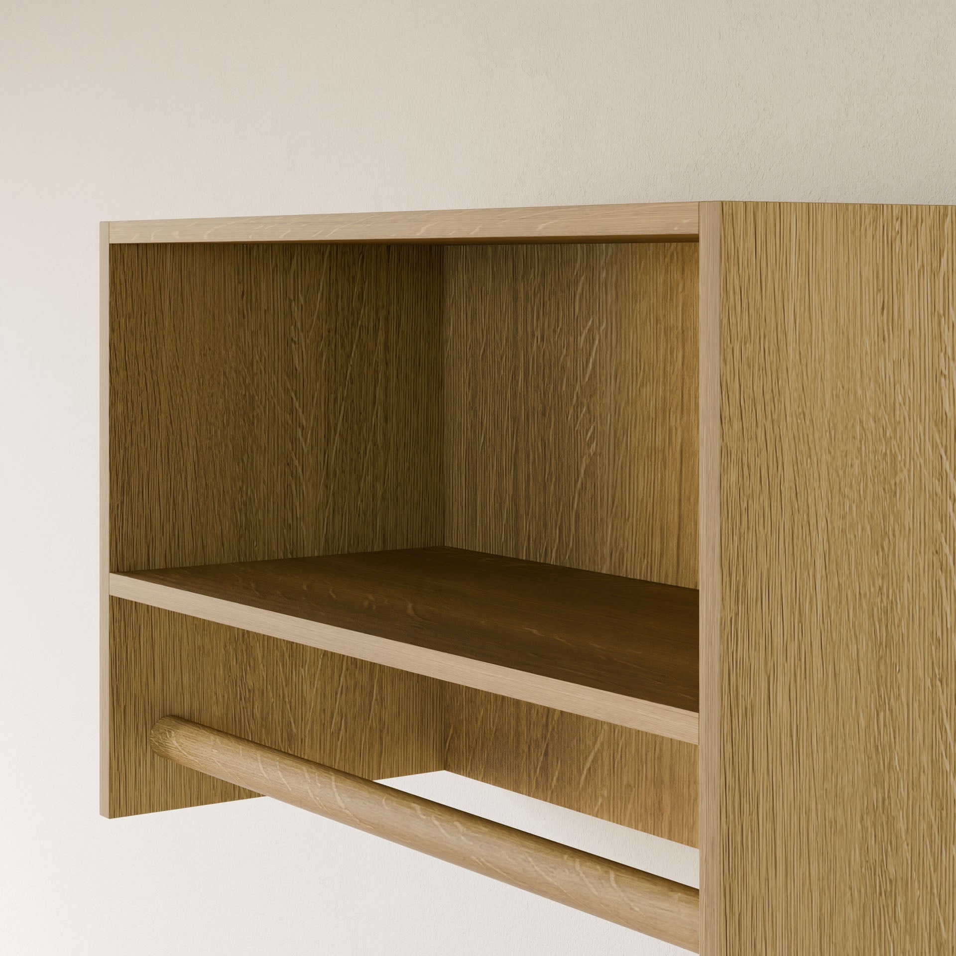 A close-up of the Maine Made Closet Hanger with Shelf by Krovel Furniture Co., handcrafted in Portland, ME from premium cabinet plywood, with an open compartment and horizontal bar mounted on a light-colored wall.