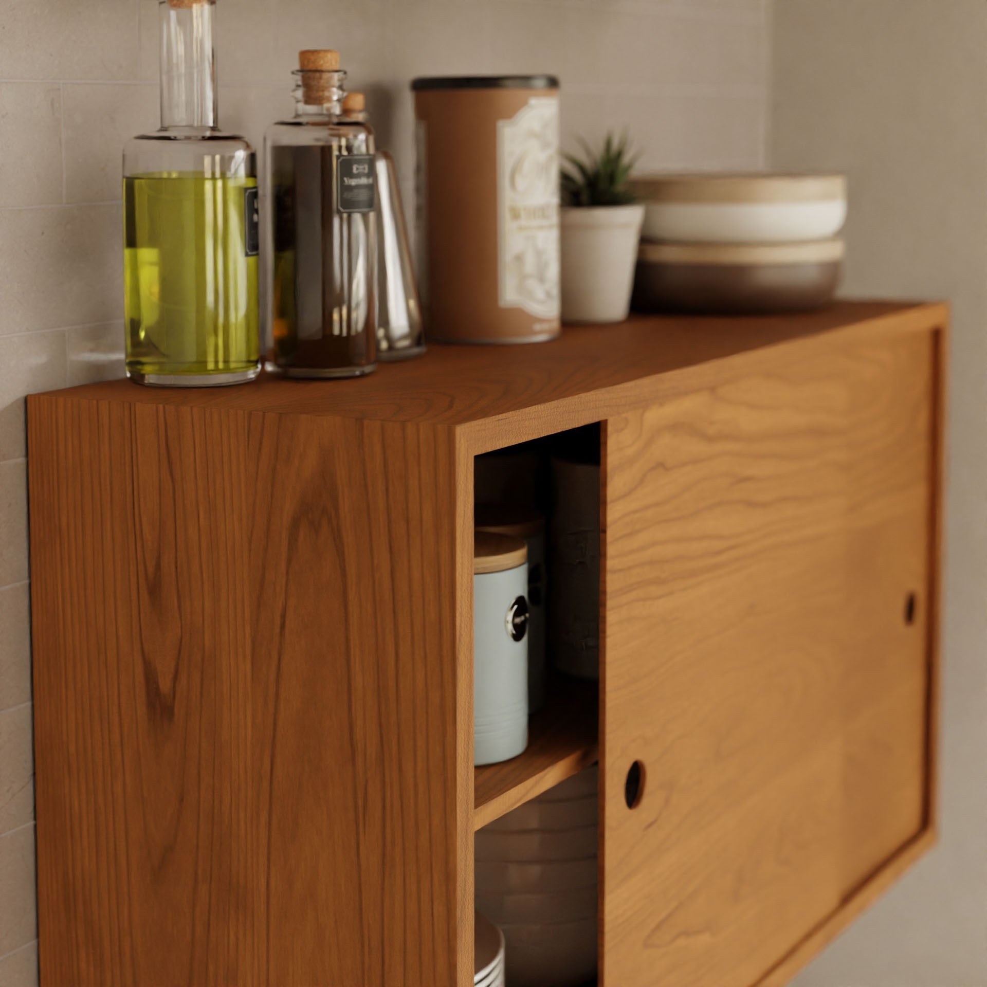 The Krovel Cupboard with Shelf in Cherry, a wall-mounted cabinet with sliding doors, elegantly displays oil bottles and a small plant on top. This unit features interior shelves for extra storage and securely mounts using a French cleat against the neutral-toned wall.