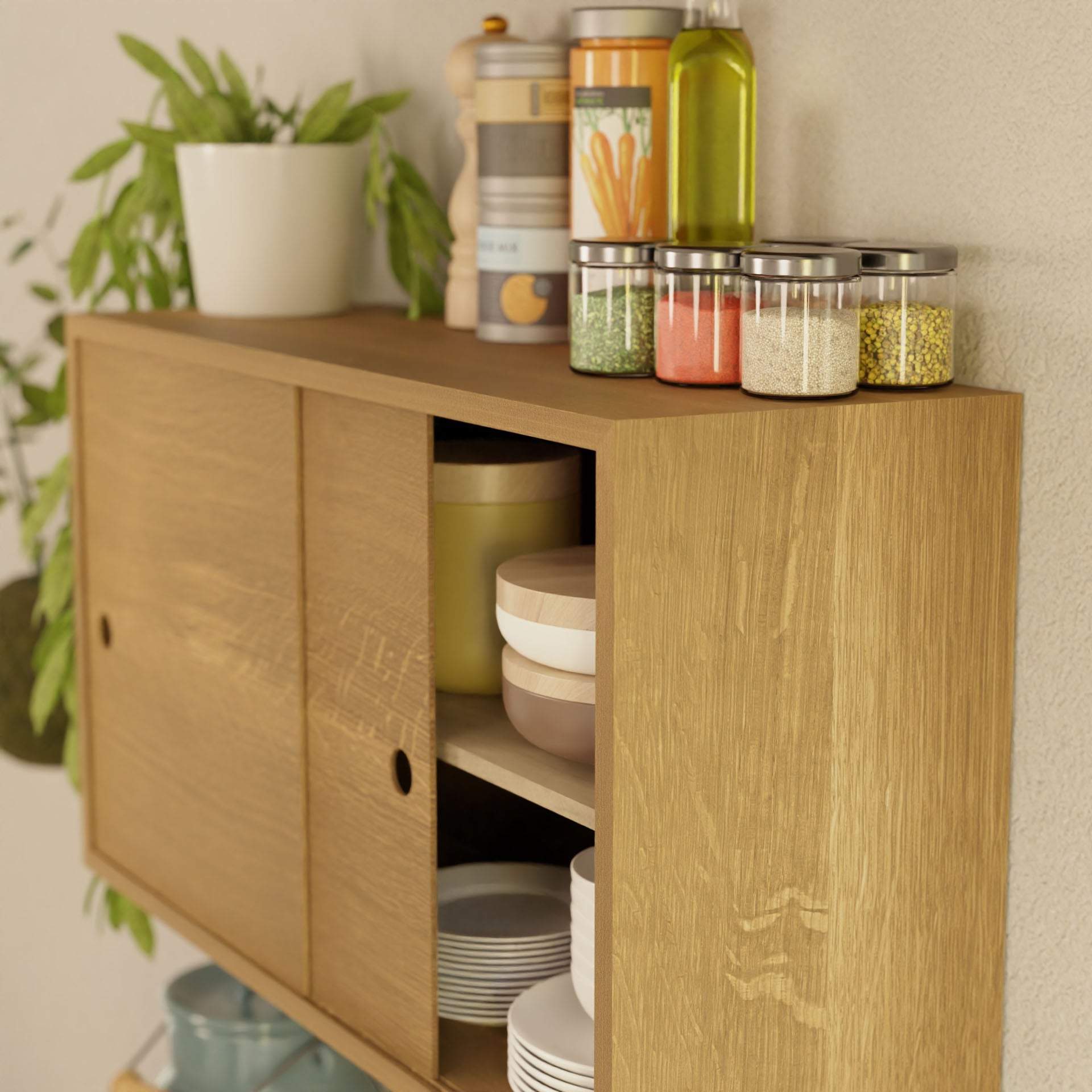 A Krovel Cupboard with Shelf in White Oak, showcasing various dishes behind sliding doors, supports small spice jars. A white plant pot adds greenery beside an olive oil bottle and pepper grinder, completing this elegant handmade display.