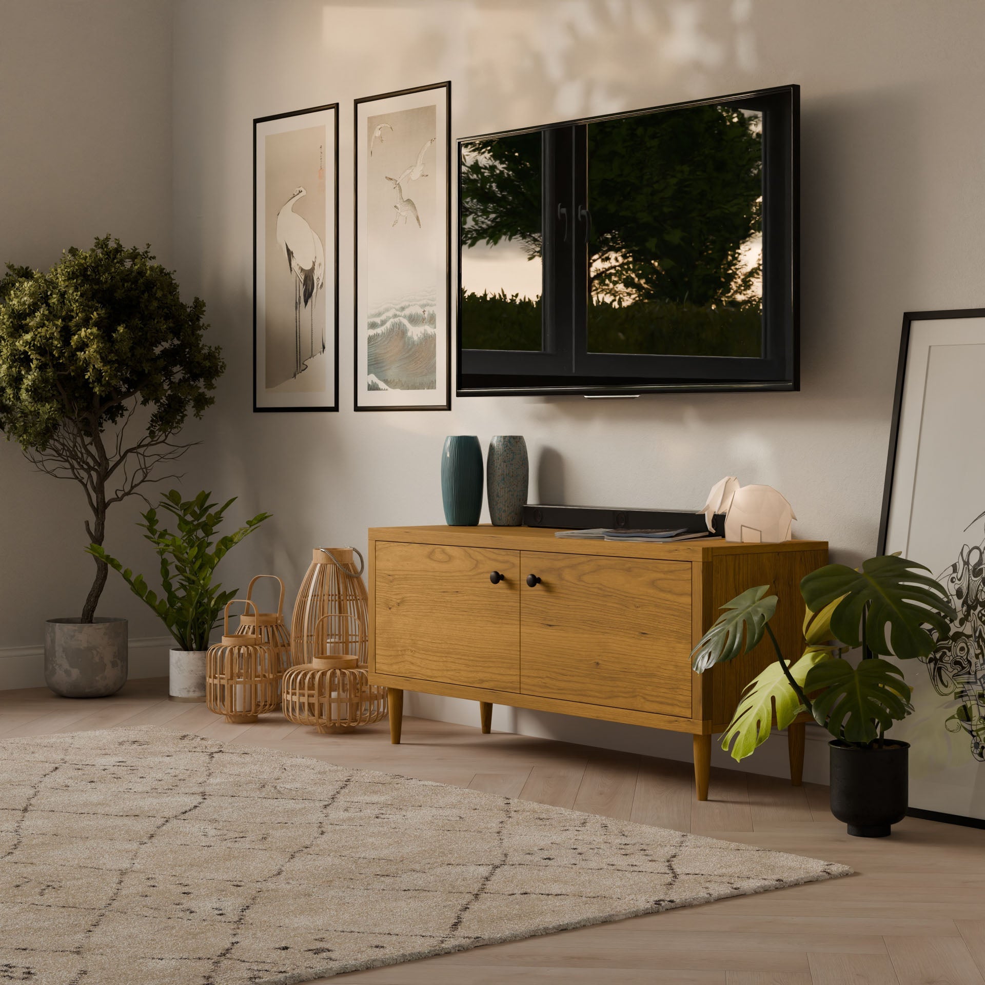 A cozy living room showcases a wall-mounted flat-screen TV. Below, a Double Door Media Cabinet in Cherry from Krovel Furniture Co. and a wooden console with formaldehyde-free hardwood veneer display vases. Art prints hang above, potted plants are nearby, and a light rug adorns the wooden floor.