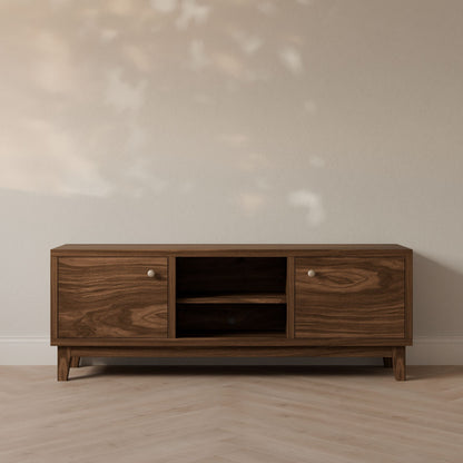 The Krovel Furniture Co. Double Door, Open Shelf Media Cabinet in Walnut features customizable side cabinets and a central open shelf, standing on short legs against a light wall with soft shadows. The floor showcases a light wood pattern.