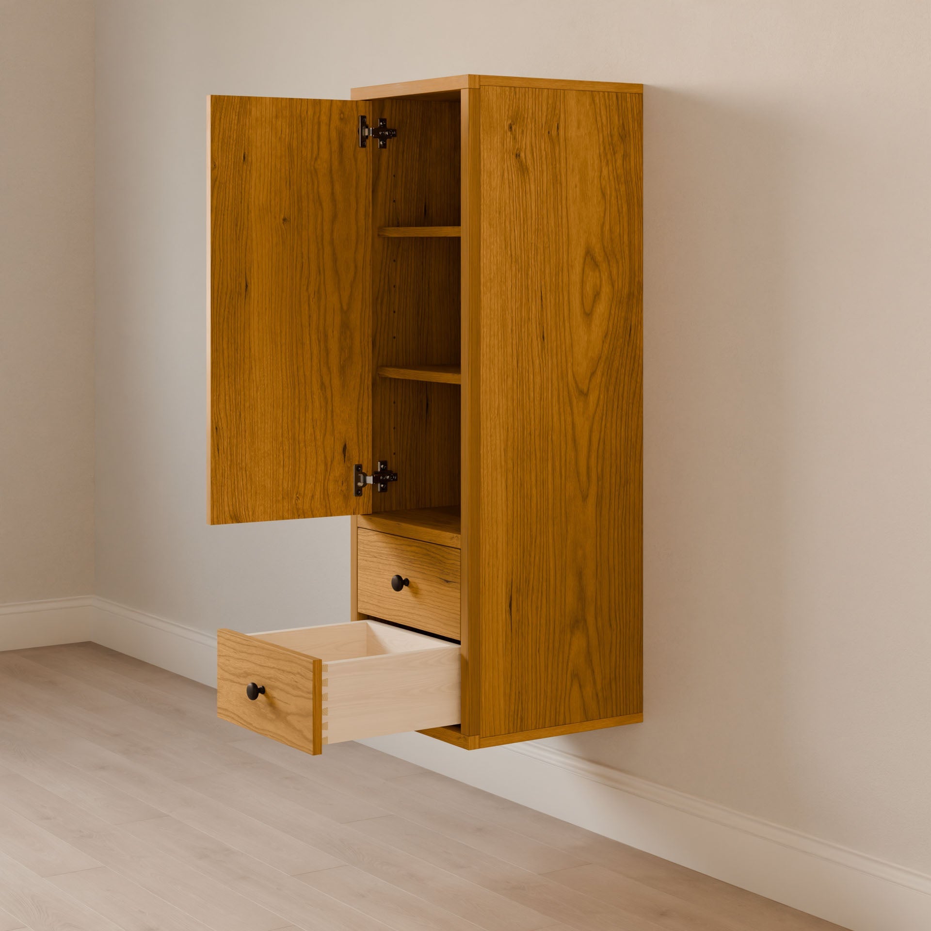 The Double Drawer Linen Cabinet in Cherry by Krovel Furniture Co. is a wooden wall-mounted cabinet made from solid hardwood, boasting an open top cupboard with shelves and two drawers. One drawer reveals an empty space, all set against a light-colored backdrop.