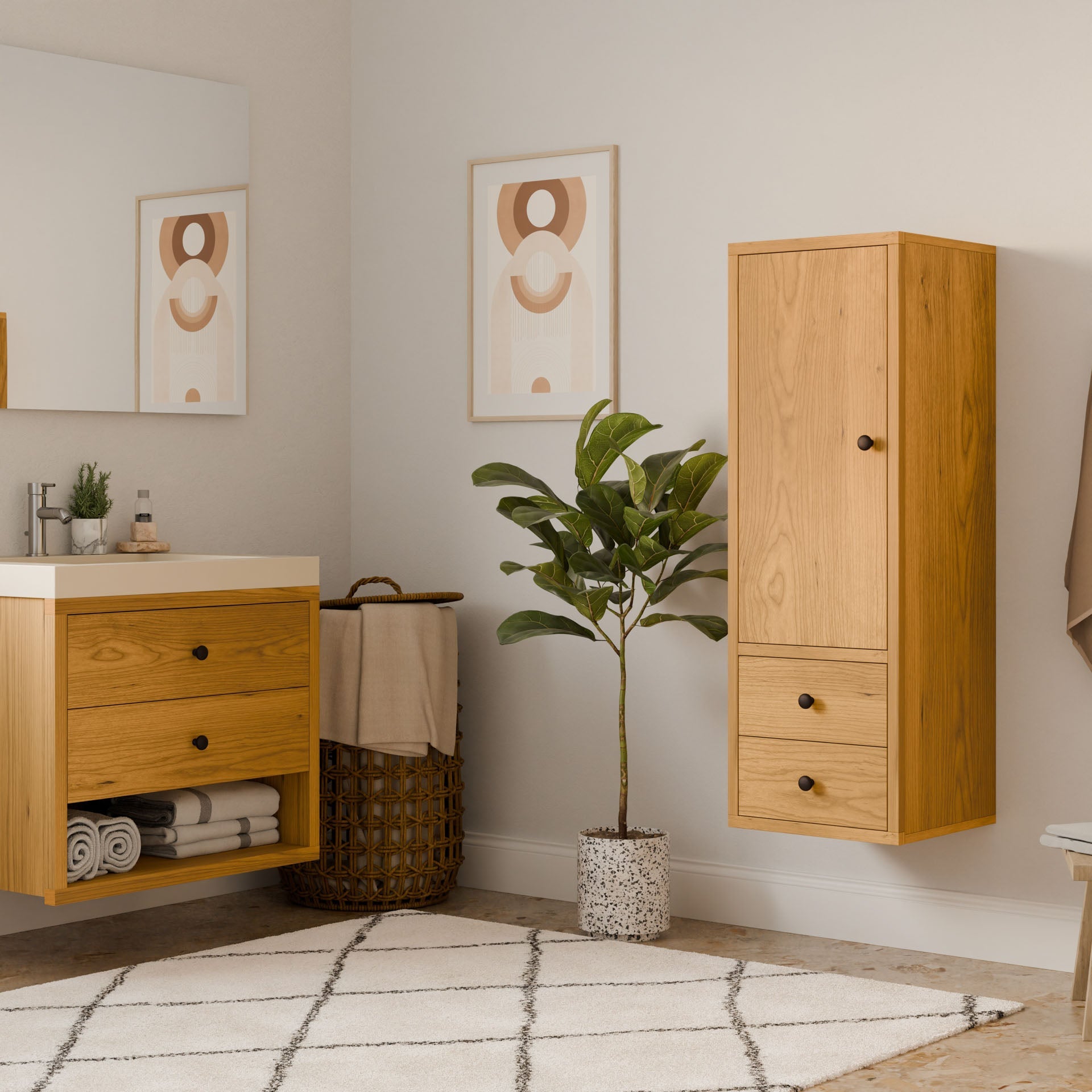 A modern bathroom highlights sustainable building with Krovel Furniture Co.s Double Drawer Linen Cabinet in Cherry and matching sink vanity. A green potted plant adorns the floor, paired with a patterned rug and minimalist art decorating the light-colored walls.