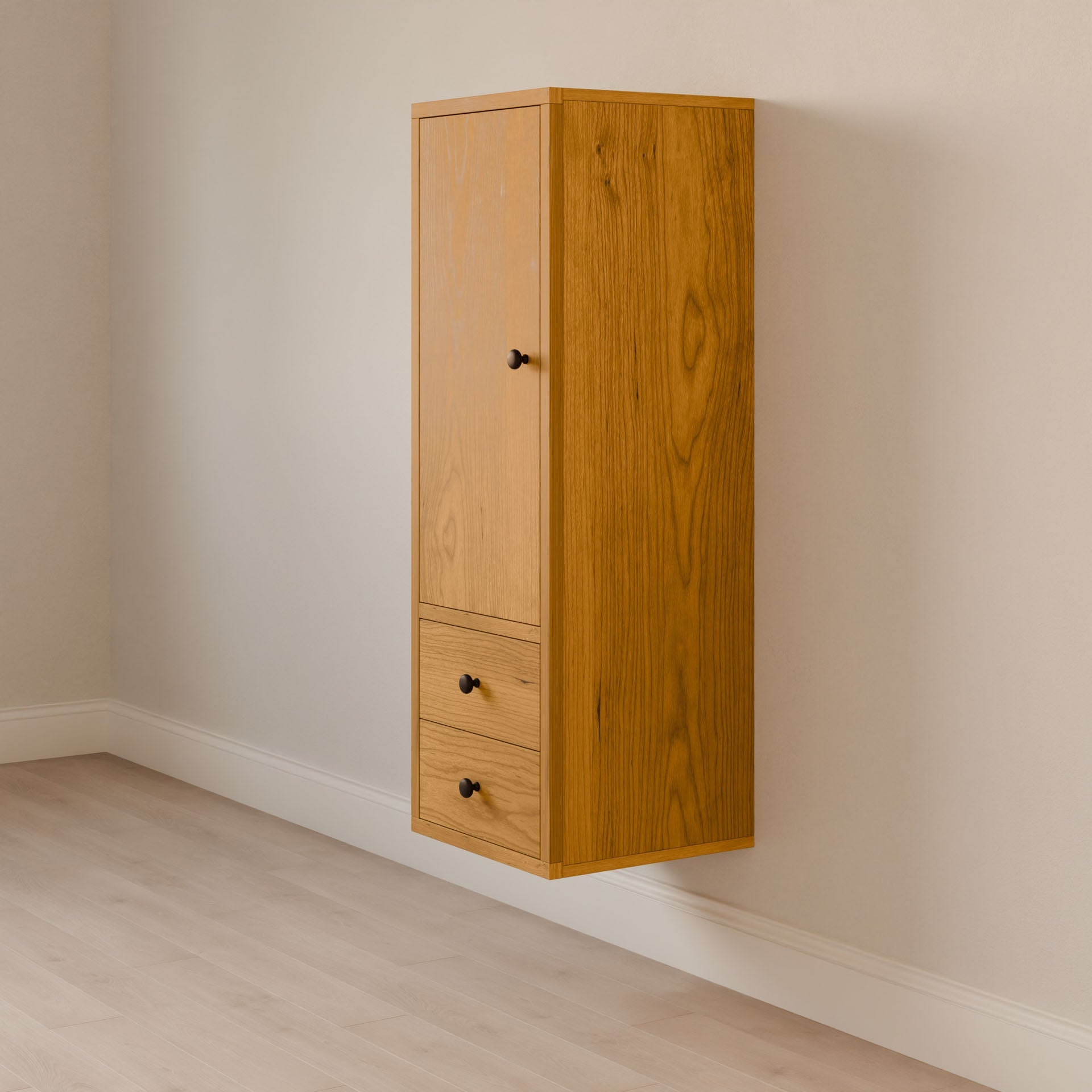 The Double Drawer Linen Cabinet in Cherry by Krovel Furniture Co. showcases sustainable solid hardwood with two drawers and a door featuring black knobs. Against a light wall and wood-textured floor, it highlights minimalist design.