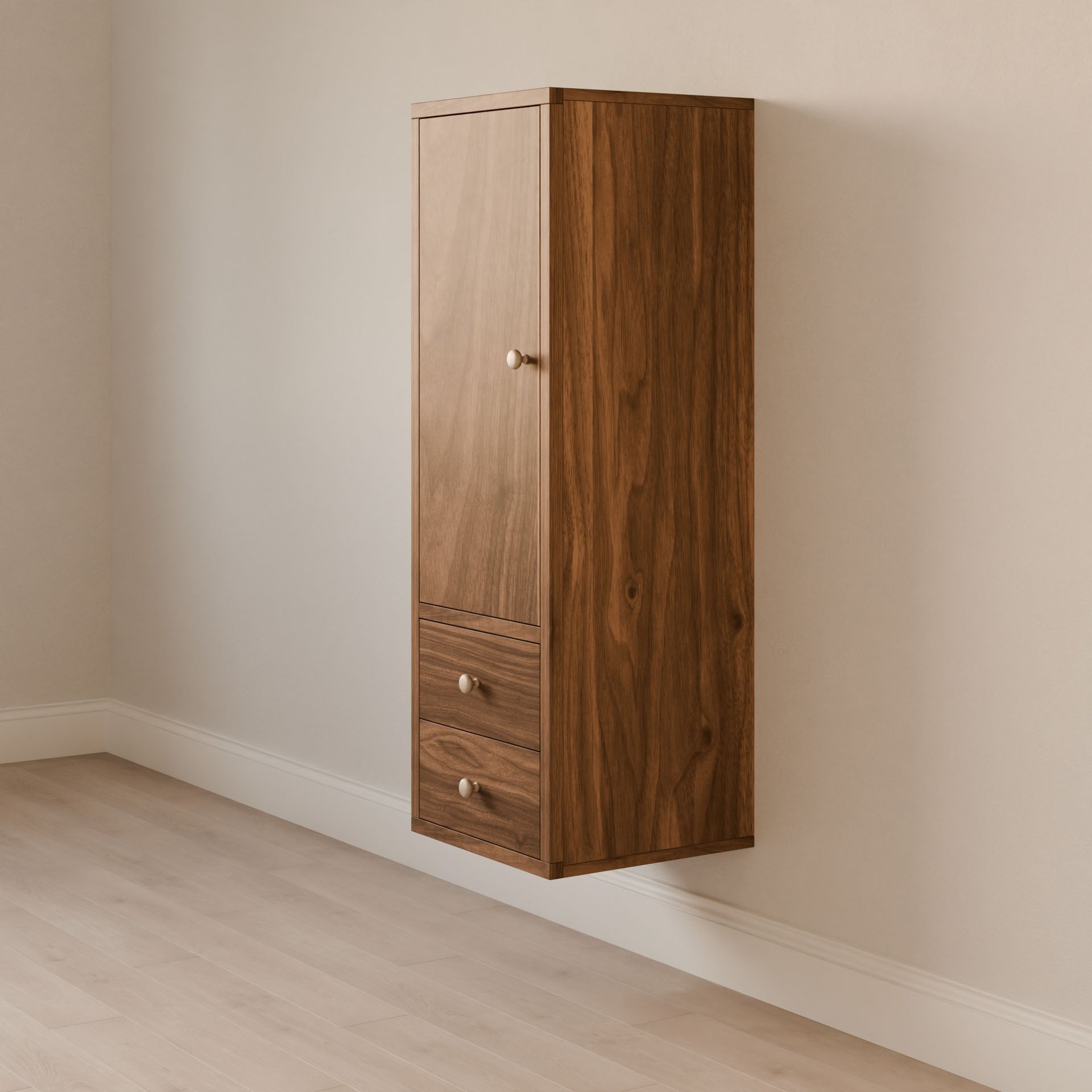 The Double Drawer Linen Cabinet in Walnut by Krovel Furniture Co. is a vertical, wall-mounted wooden cabinet with a natural finish, featuring a small door and two drawers with metallic knobs. Its sustainable design complements rooms with light wood flooring and is available in customizable sizes.