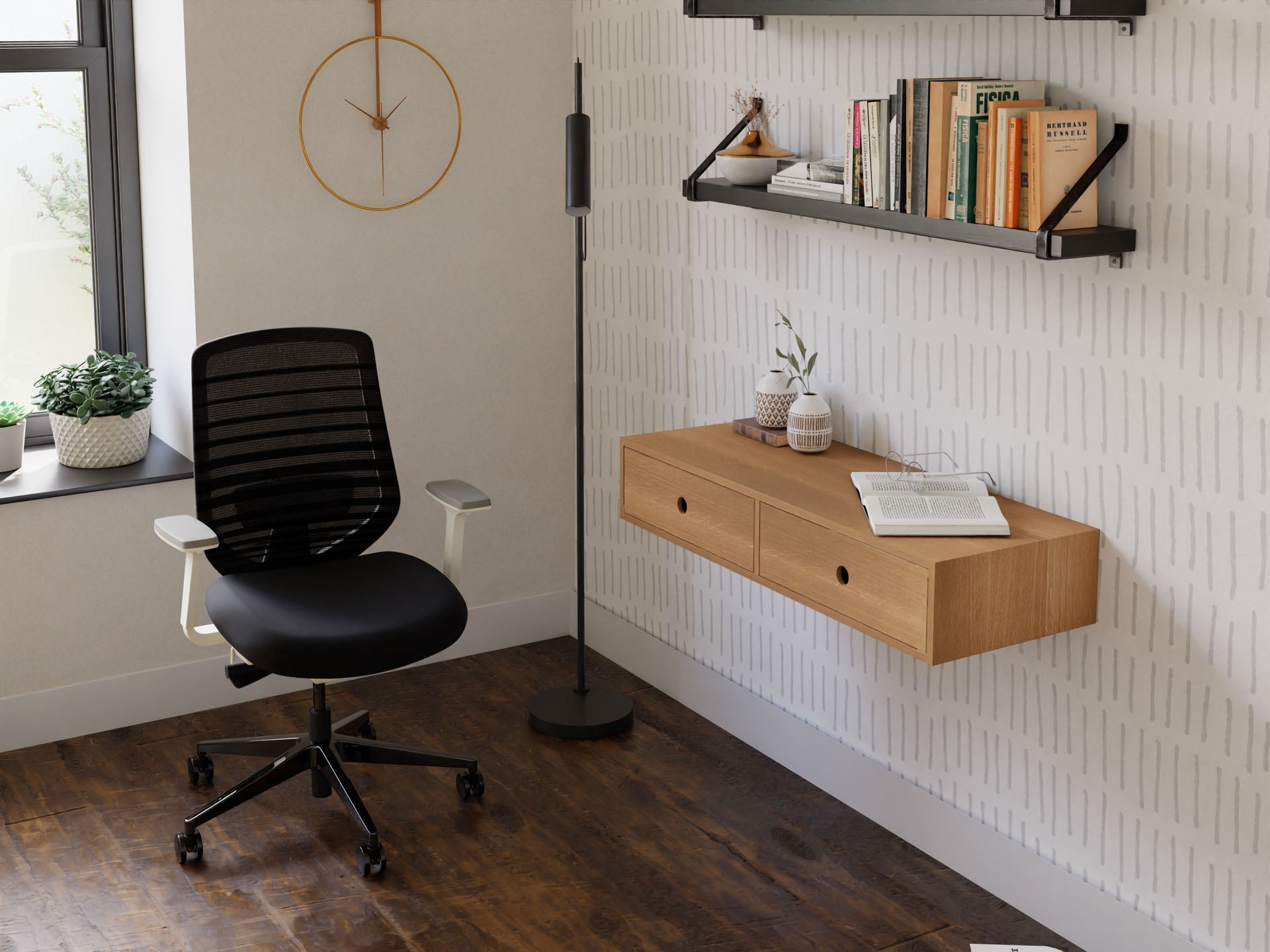 A minimalist home office includes a Krovel hand-finished Floating Desk in White Oak against a light-patterned wall. A black swivel chair complements it, with shelves above for books and decor. A window on the left illuminates a floor lamp and wall clock.