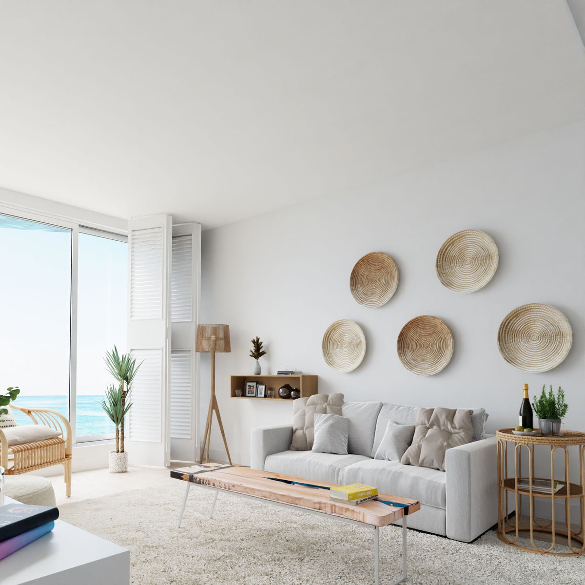 A bright, modern living room features a light gray sofa, woven wall baskets, Krovel Floating Display Case in Maple shelves, a wooden coffee table, large ocean-view windows, indoor plants, and minimalistic decor for a cozy airy vibe.