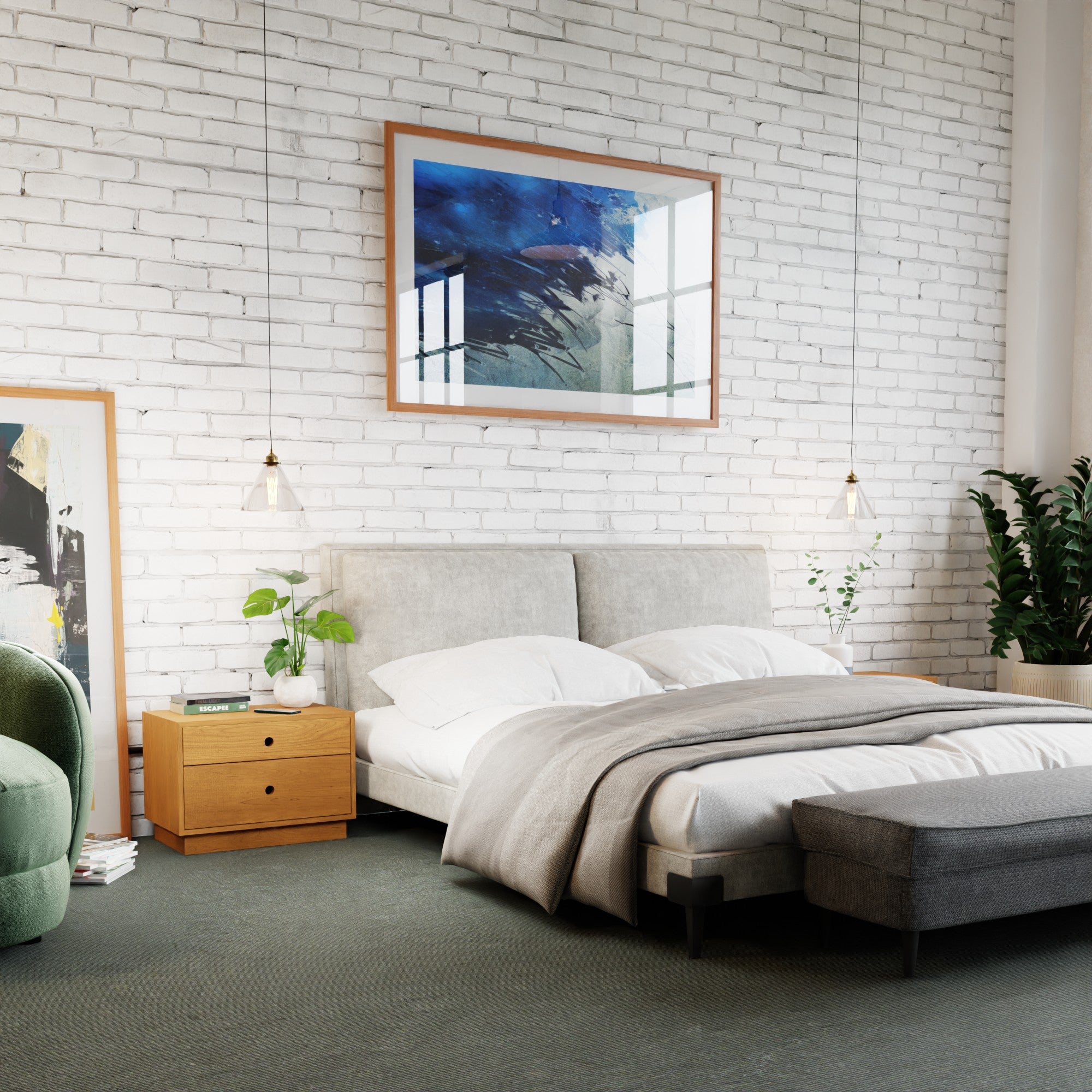 Modern bedroom with a white brick wall, abstract art, light grey upholstered bed, white bedding, Krovel Hardwood Freestanding Nightstand with plants, pendant lights, and a green armchair next to a large leafy plant.