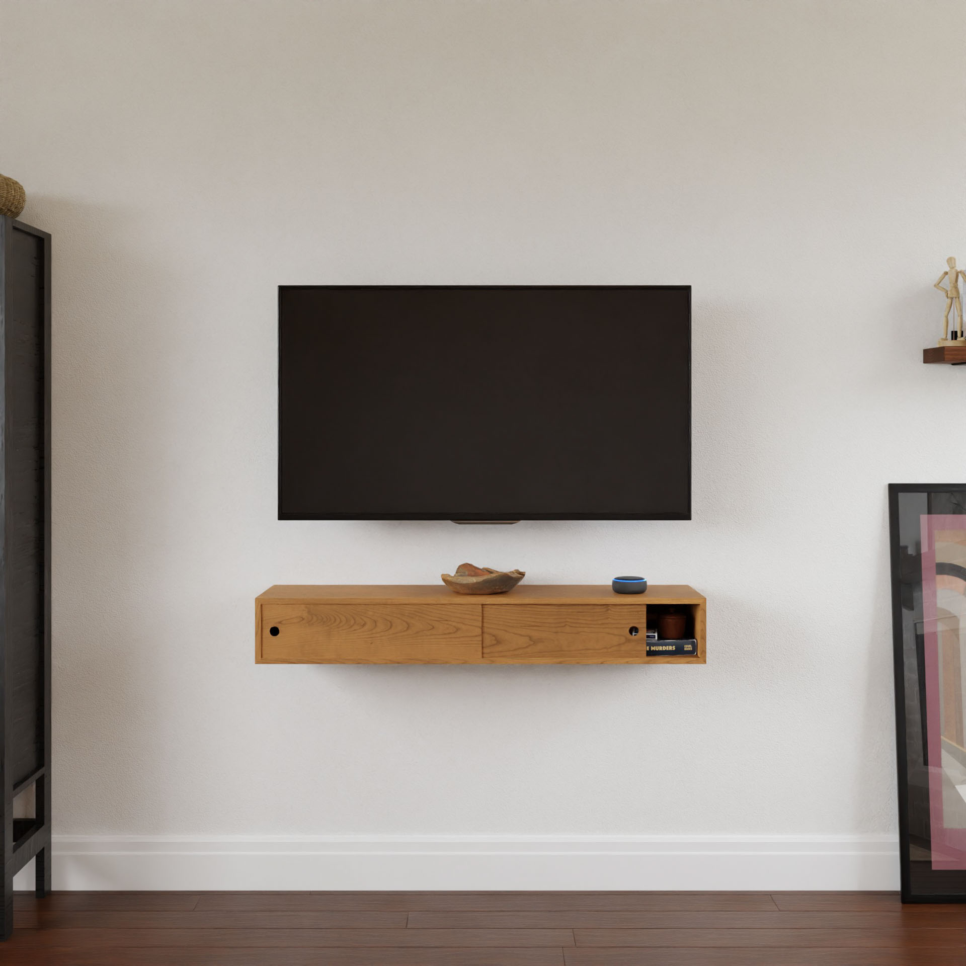 A flat-screen TV is mounted above a Krovel Media Console Table in Cherry. The rich wooden shelf holds a decorative bowl and an electronic device. Light-colored walls and wooden floors complement the scene, alongside glimpses of a cabinet and framed artwork.