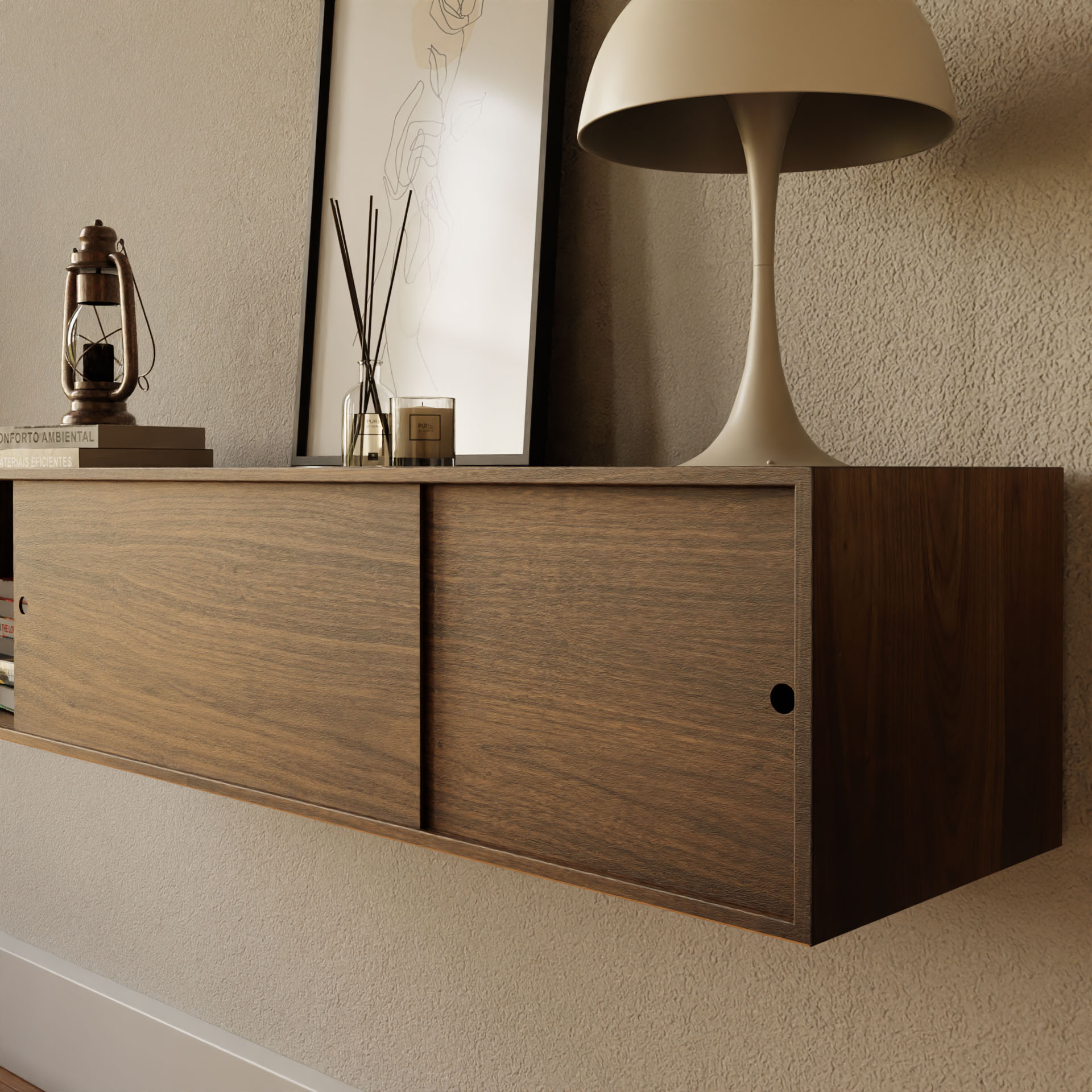 The Krovel Hardwood Oversized Media Console with sliding doors is styled with a beige lamp, framed line drawing, lantern, reed diffusers, and glass cube against a textured beige wall.