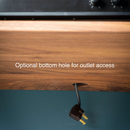 The Krovel Hardwood Oversized Media Console includes a solid hardwood TV stand design with an optional small round hole near the bottom edge for easy outlet access. Text on the image: Optional bottom hole for outlet access.