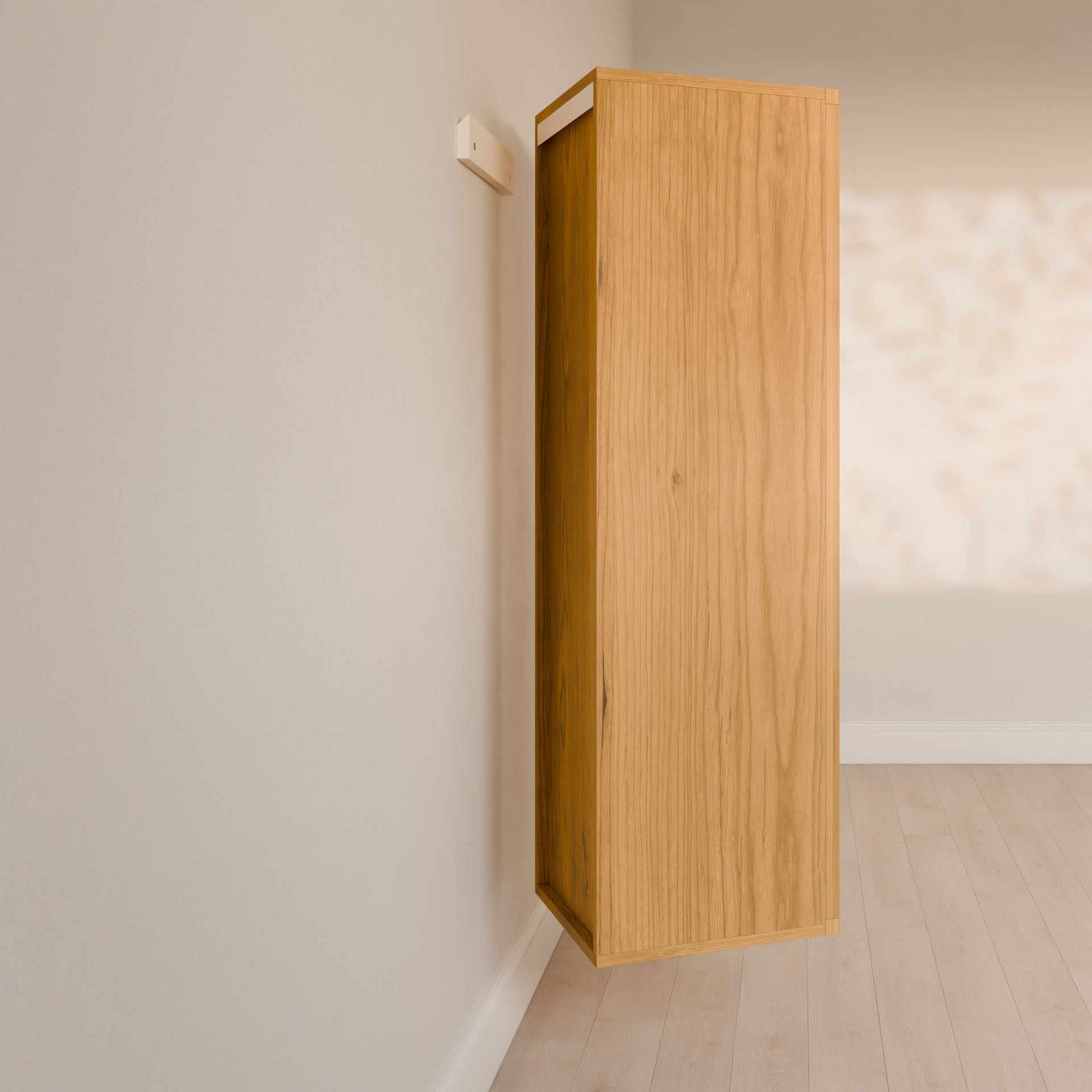 In a minimalist room with light wood flooring, the Triple Drawer Linen Cabinet in Cherry by Krovel Furniture Co. is elegantly mounted sideways on the wall. Its vertical alignment creates intriguing light and shadow patterns, embodying sustainable principles while adding airy elegance to the space.