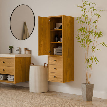 A minimalist bathroom with sustainable design includes a Triple Drawer Linen Cabinet in Cherry by Krovel Furniture Co., revealing towels and toiletries. A round mirror is above the sink with a wooden vanity, while a tall potted plant and woven rug complete the look.