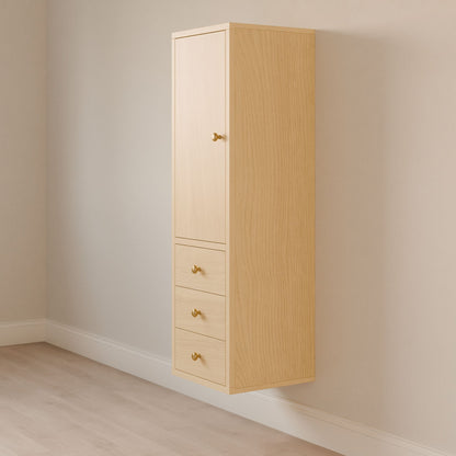 The Krovel Furniture Co. Triple Drawer Linen Cabinet in Maple, featuring a hardwood face frame, is mounted on a beige wall above a light hardwood floor. It has one top door and three soft-close drawers below, each with a small round knob.